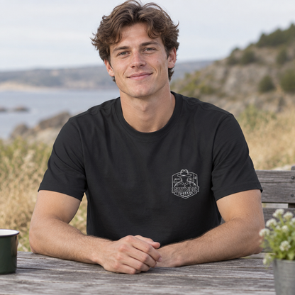 Man in a dark grey Weathered Compass T-Shirt, front view with the GreyRider Threads left-chest logo