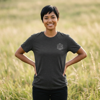 Woman wearing a dark grey heather Spartan Thin Blue Line T-Shirt with the GreyRider Threads left-chest logo